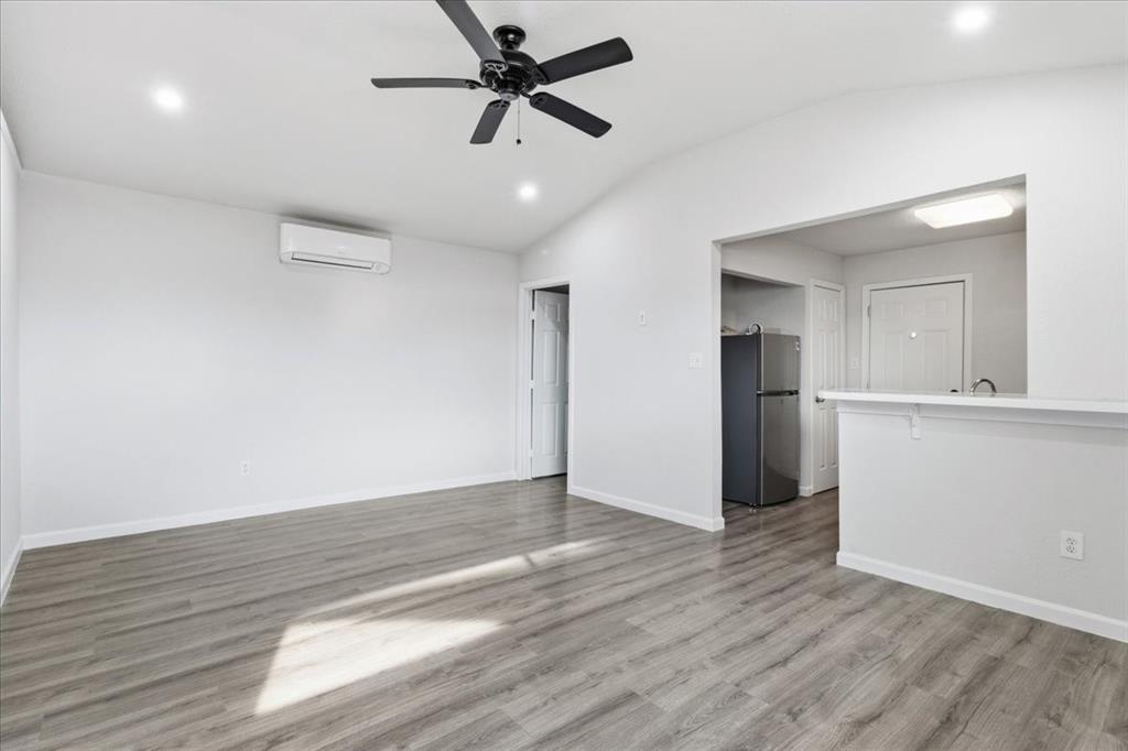404 South Murray Street McKinney, TX 75069 - Photo 21 of 23 a view of empty room with wooden floor and window