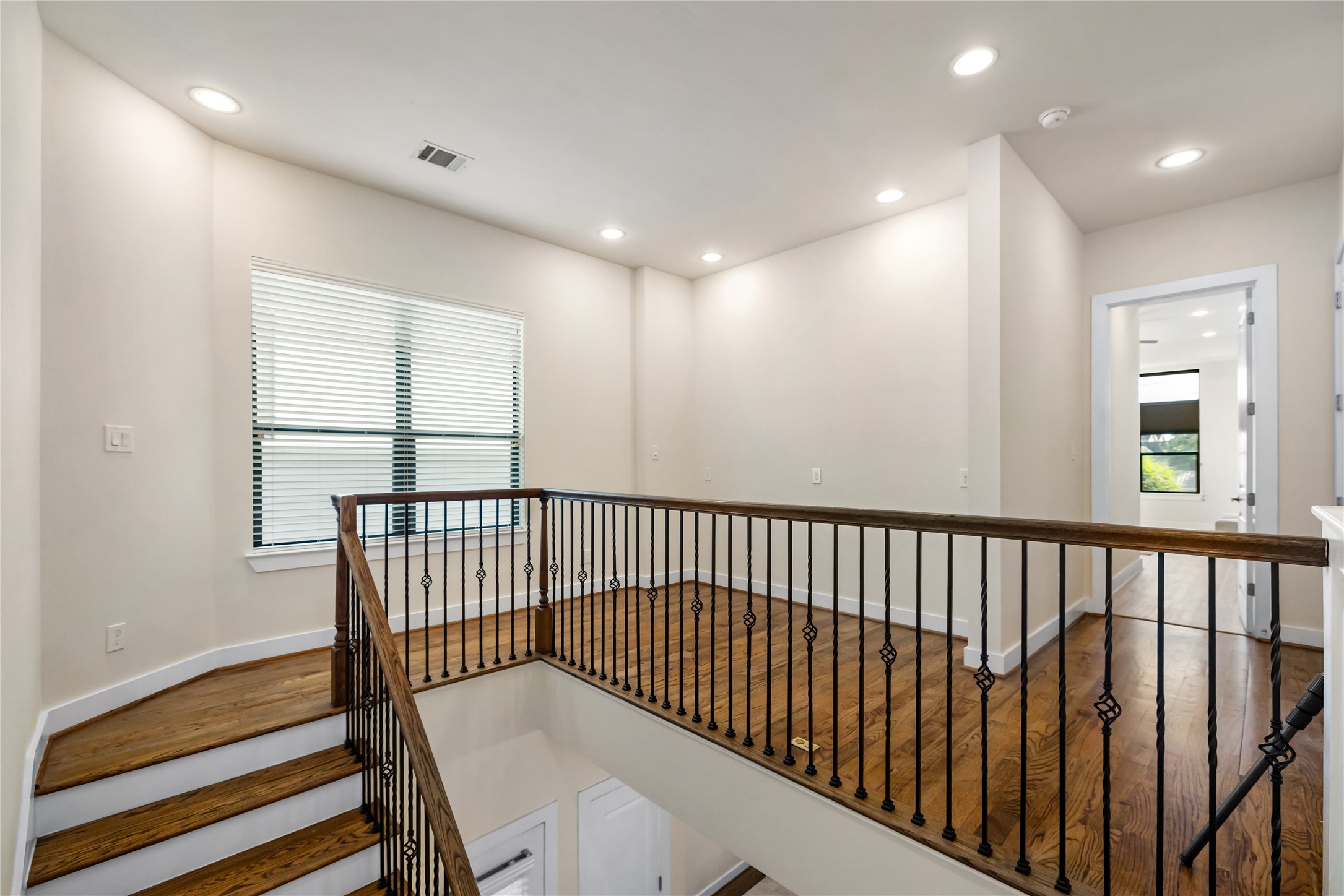 4409 Schuler Street, Unit A Houston, TX 77007 - Photo 16 of 30 a view of hallway with wooden floor