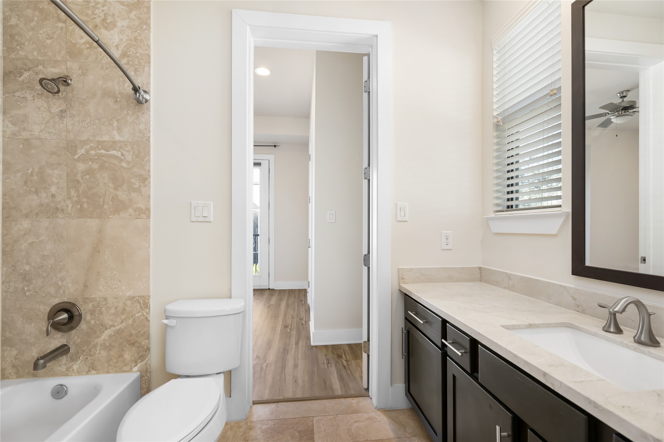 4409 Schuler Street, Unit A Houston, TX 77007 - Photo 25 of 30 a bathroom with a sink a toilet and shower