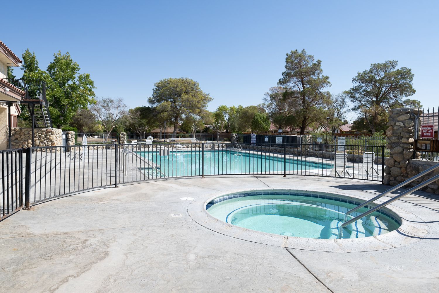 418 Mt Rainier Place Ridgecrest, CA 93555 - Photo 38 of 45 a view of a swimming pool with a patio and a yard