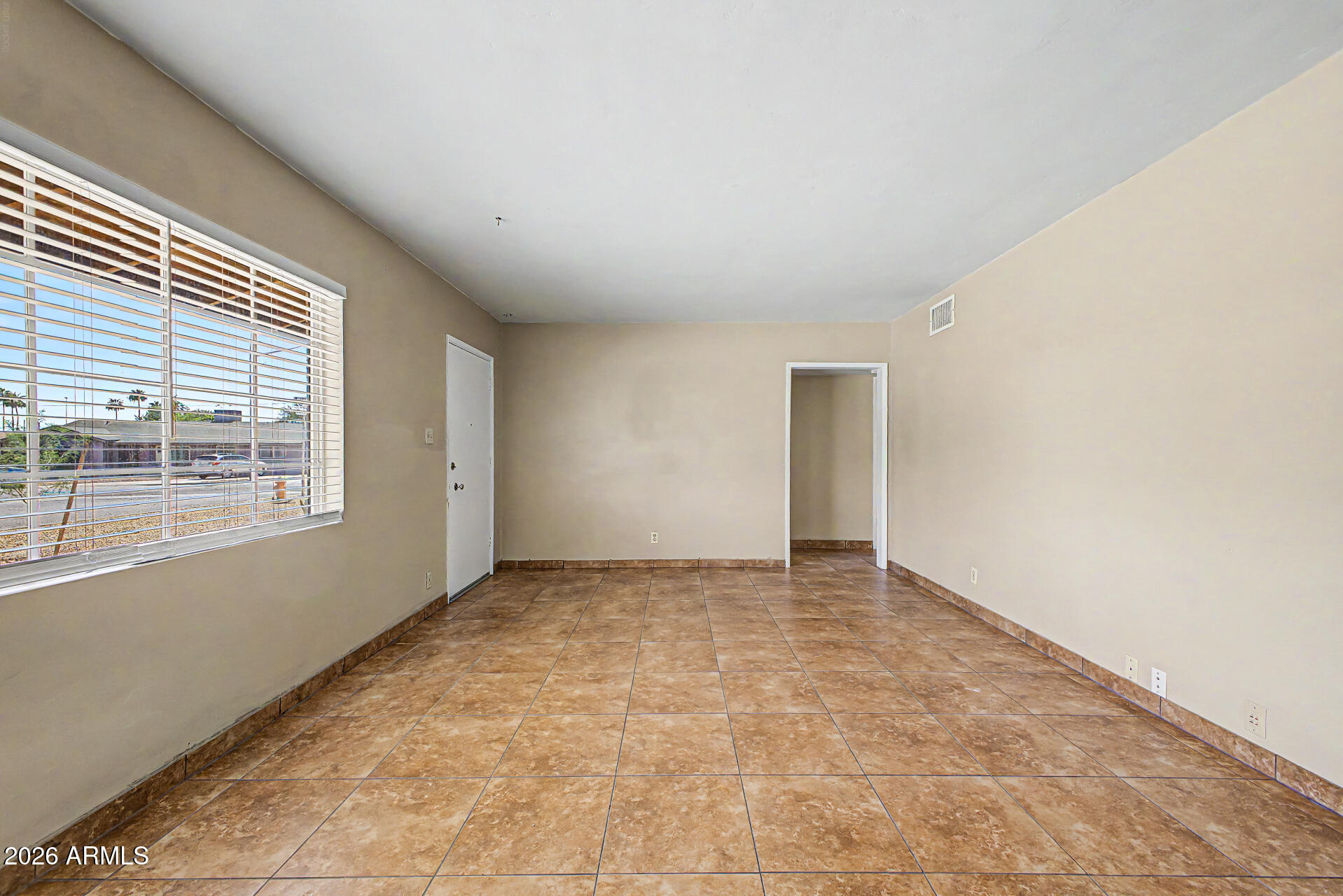 2022 East Monterey Way Phoenix, AZ 85016 - Photo 6 of 29 a view of an empty room with a window