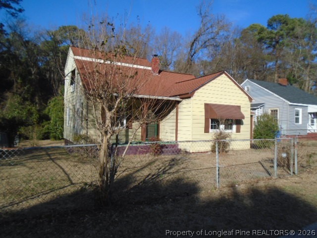 310 Hawthorne Road Fayetteville, NC 28301 - Photo 1 of 13 a view of a house with a yard