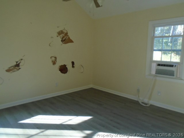 310 Hawthorne Road Fayetteville, NC 28301 - Photo 11 of 13 an empty room with wooden floor and windows
