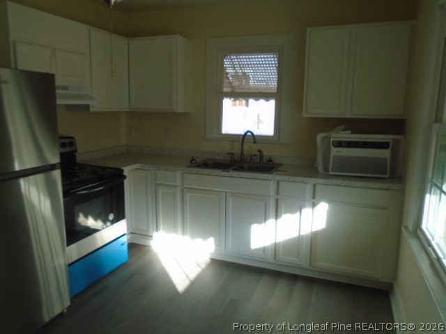 310 Hawthorne Road Fayetteville, NC 28301 - Photo 7 of 13 a kitchen with counter top space cabinets and appliances