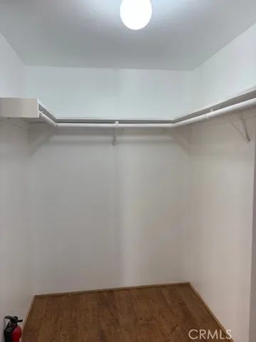a view of an empty walk in closet
