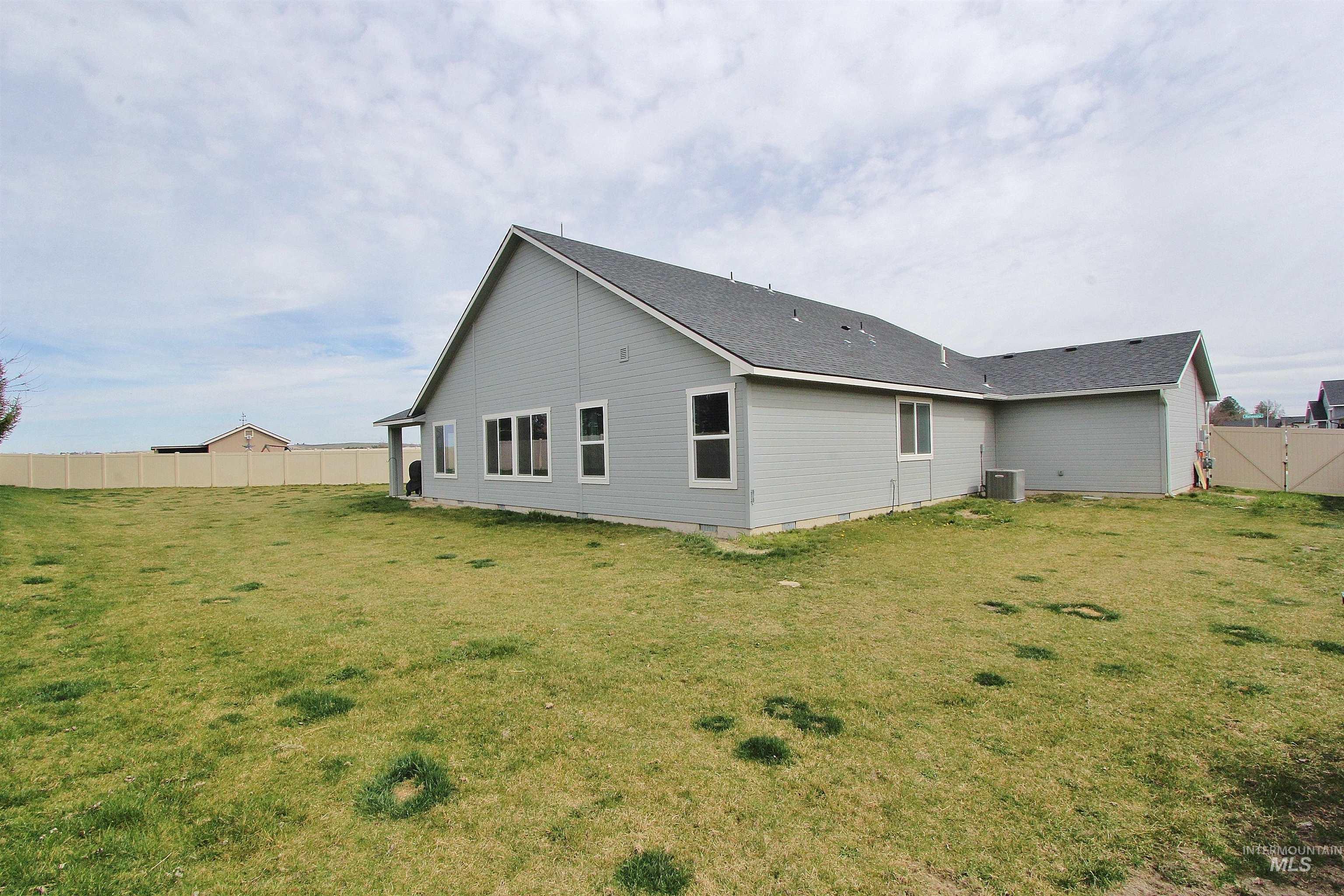 1211 Mahogany Street Parma, ID 83660 - Photo 21 of 22 Rear view of property featuring roof with shingles