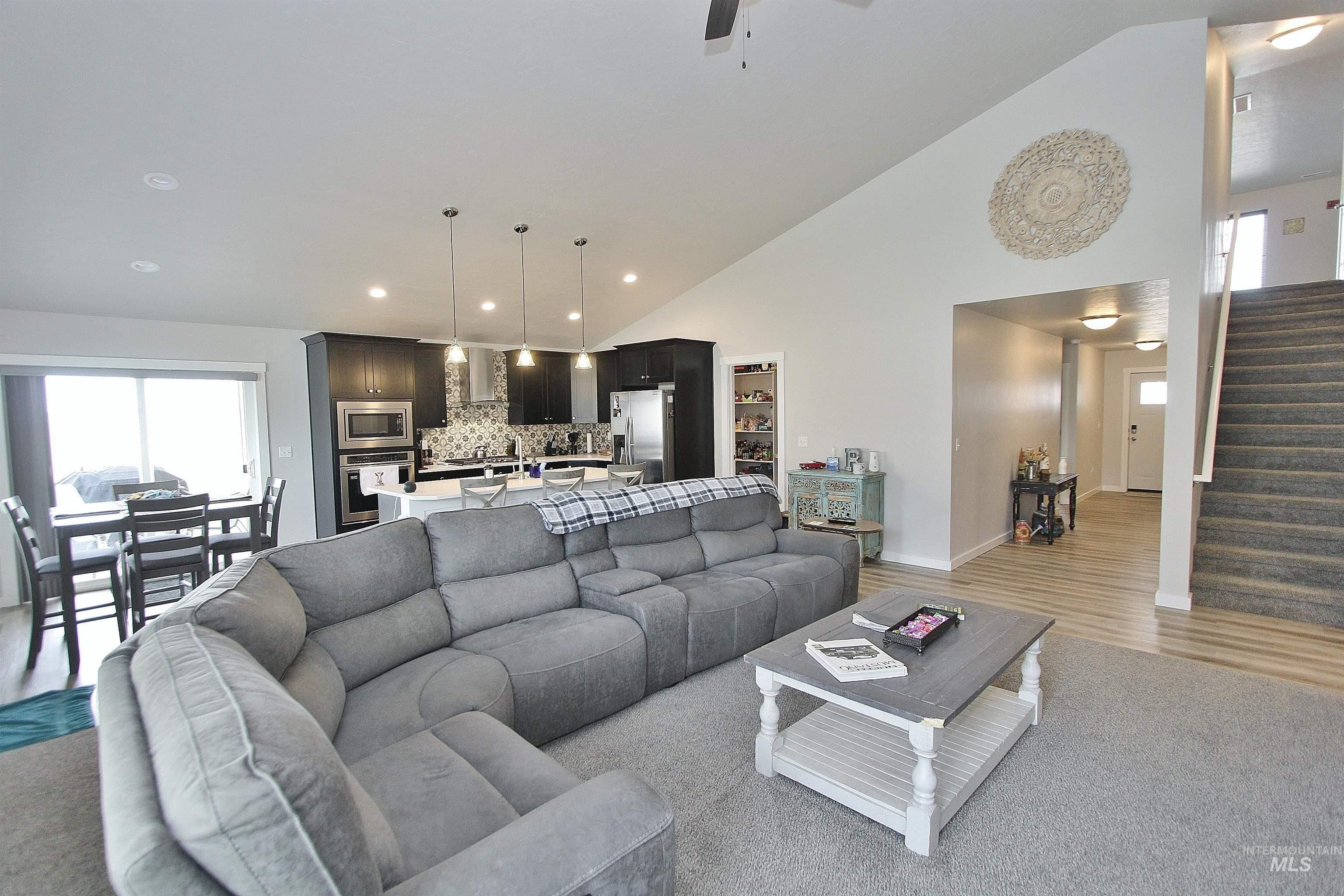 1211 Mahogany Street Parma, ID 83660 - Photo 4 of 22 Living area featuring lofted ceiling, recessed lighting, and a ceiling fan