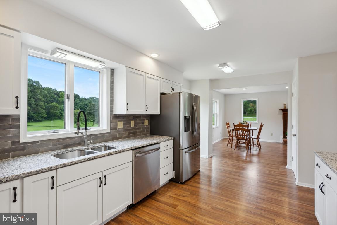 2134 Freeland Road Freeland, MD 21053 - Photo 13 of 39 New vinyl plank flooring, door leads to deck