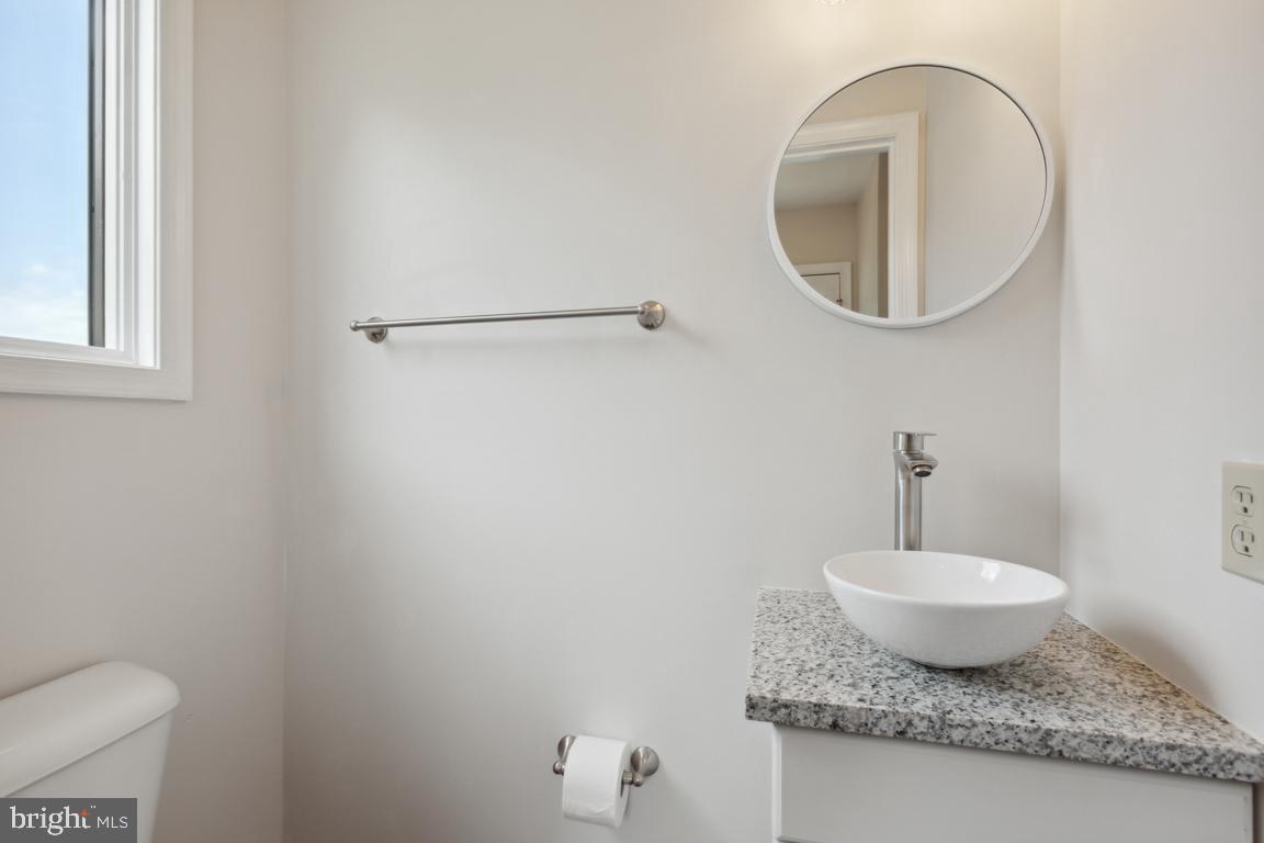 2134 Freeland Road Freeland, MD 21053 - Photo 15 of 39 Half bath main level
New granite vanity & floors