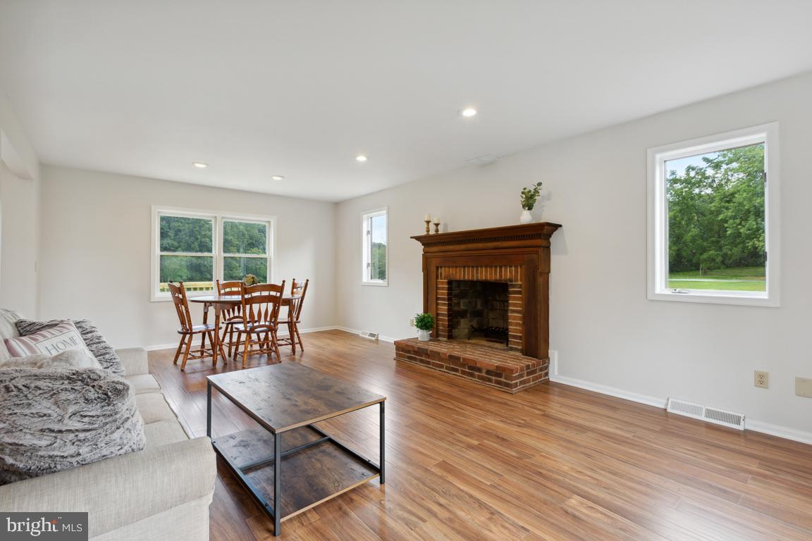 2134 Freeland Road Freeland, MD 21053 - Photo 8 of 39 Family rm new vinyl plank floors & wood burning fp