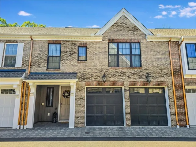 a view of a brick house with front door
