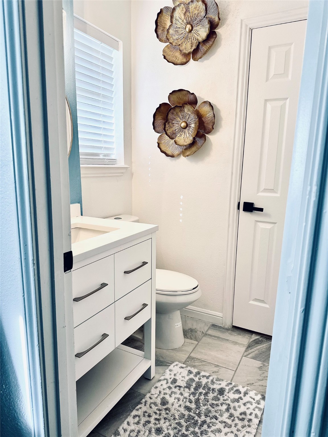 1457 Camellia Street Sweeny, TX 77480 - Photo 26 of 34 a bathroom with a toilet a sink and vanity