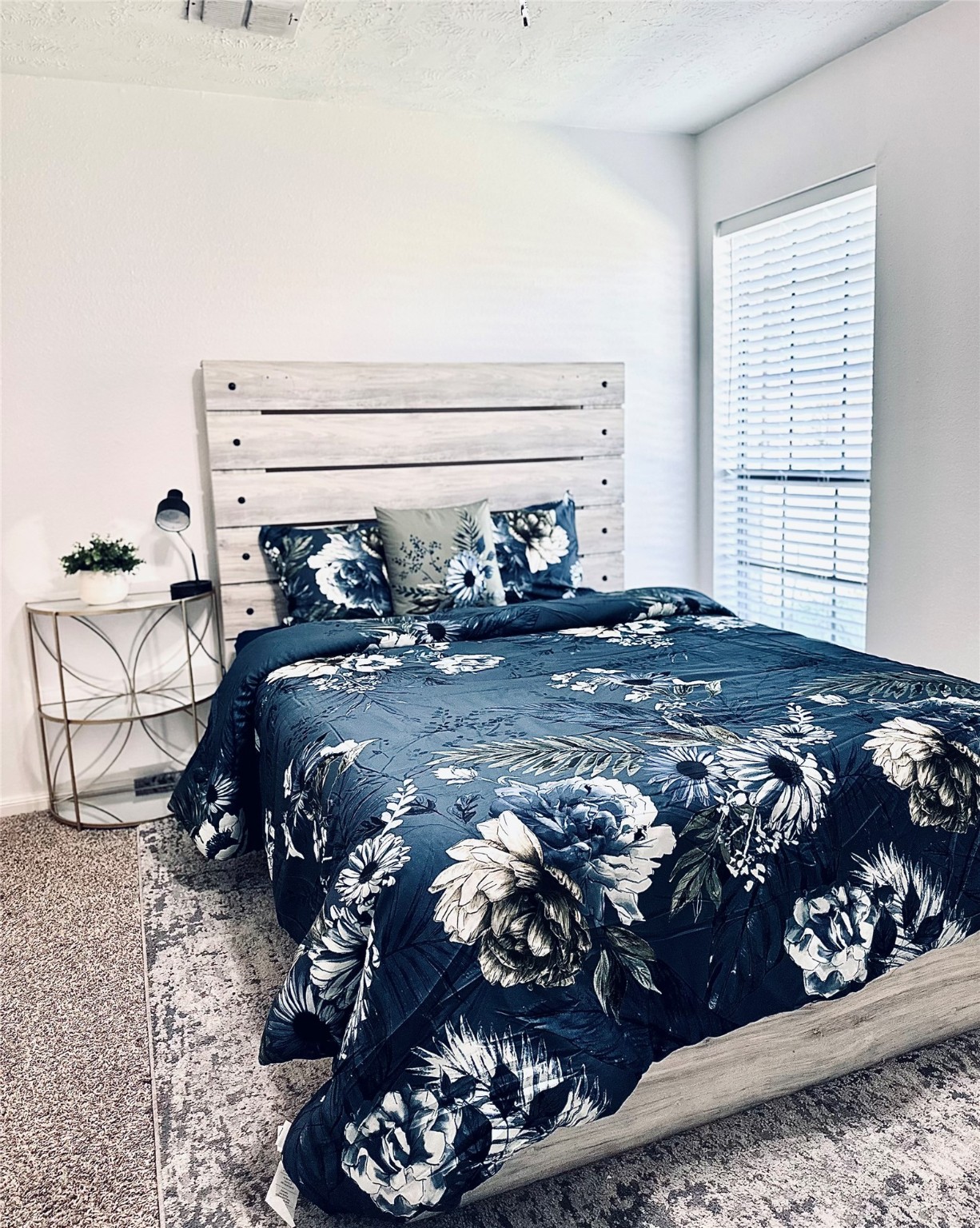 1457 Camellia Street Sweeny, TX 77480 - Photo 30 of 34 a bed sitting in a bedroom next to a window and dresser