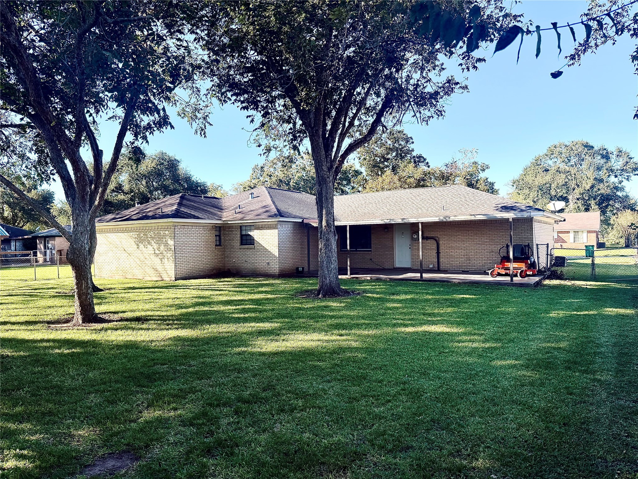 1457 Camellia Street Sweeny, TX 77480 - Photo 33 of 34 a view of a house with a yard