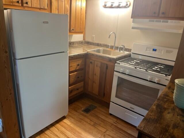53 Tryon Farm Lane Michigan City, IN 46360 - Photo 8 of 30 a kitchen with a stove and a refrigerator