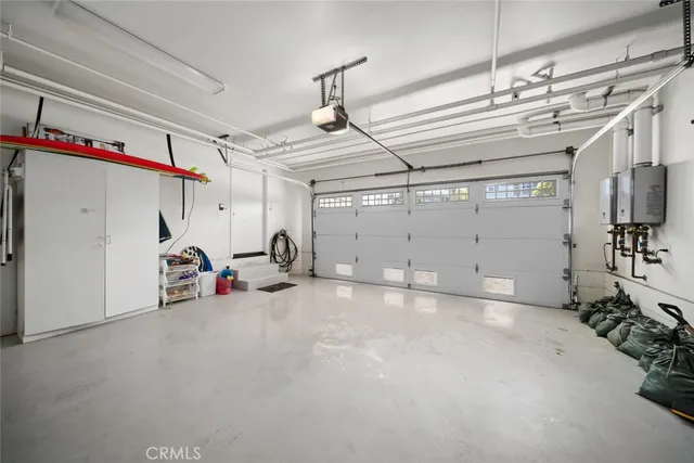 a living room with furniture large window and a table