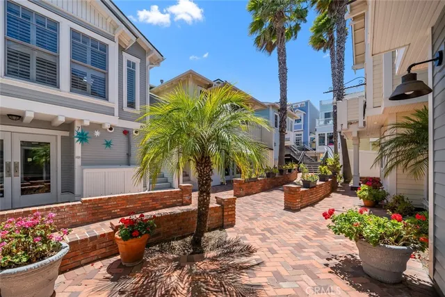 a bedroom with a bed and a mirror on dresser