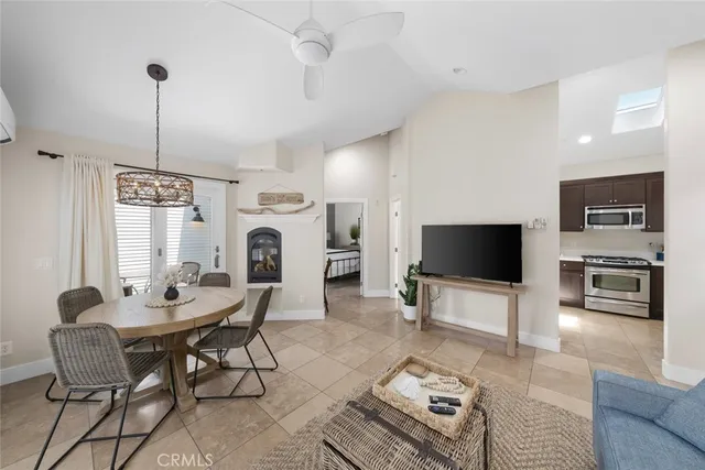 a room with gym equipment and a chandelier