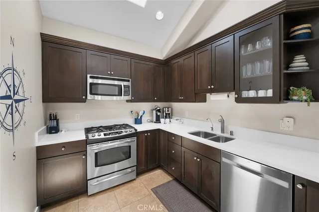 a view of a livingroom with furniture wooden floor and a rug