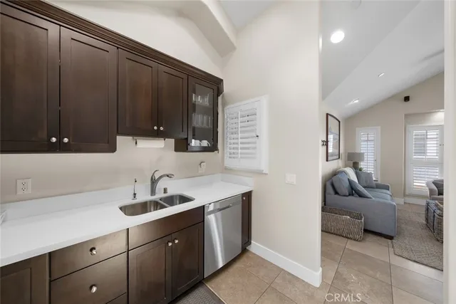 an aerial view of multiple houses with a yard