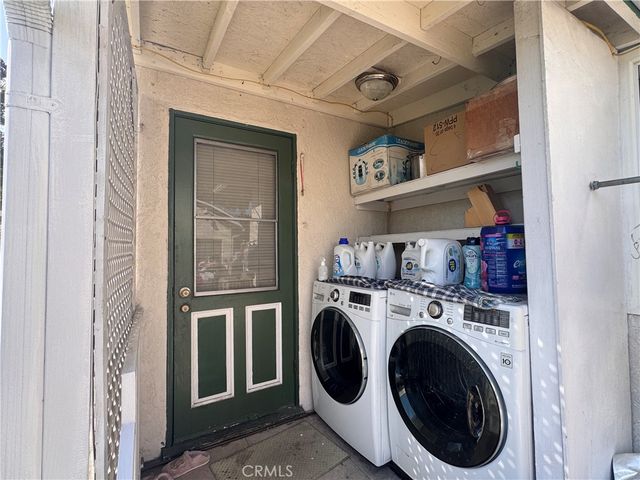 a view of washer and dryer in a utility room