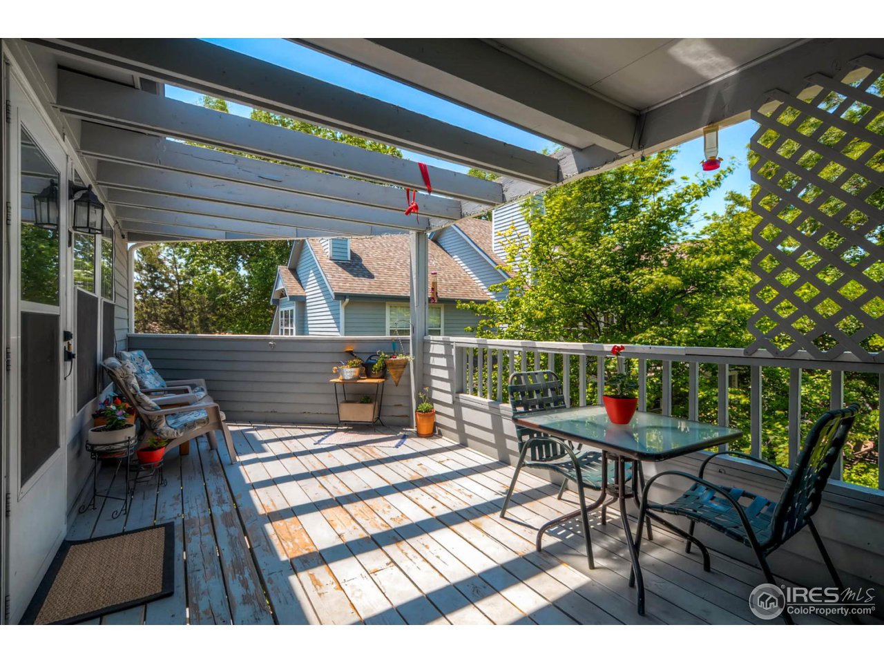 1601 West Swallow Road, Unit 1J Fort Collins, CO 80526 - Photo 5 of 28 Neat pergola on this HUGE deck!