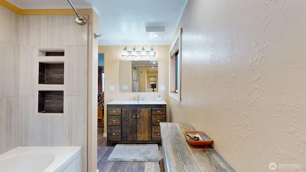 a bathroom with a sink and a mirror
