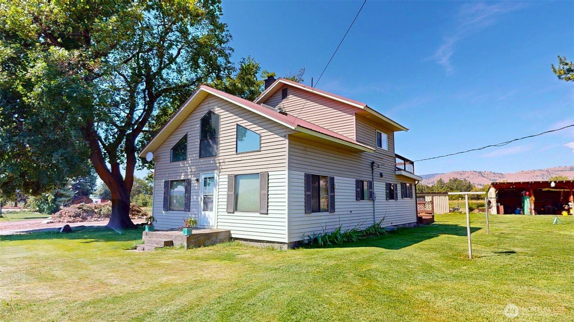 79 Duck Lake Road Omak, WA 98841 - Photo 2 of 40 a backyard of a house with yard and outdoor seating