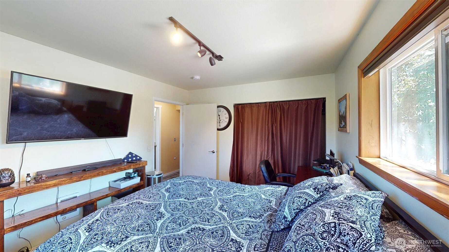 79 Duck Lake Road Omak, WA 98841 - Photo 21 of 40 a bedroom with a bed and a flat screen tv