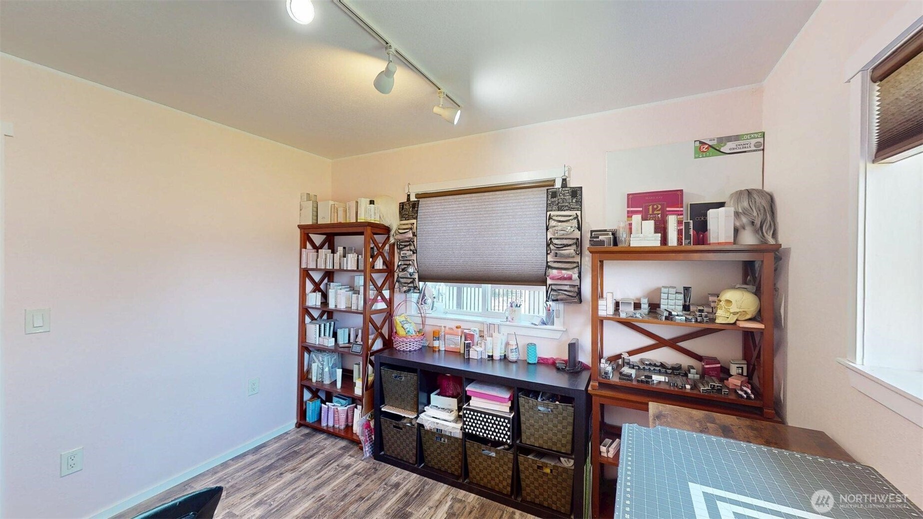 79 Duck Lake Road Omak, WA 98841 - Photo 22 of 40 a wooden floor with lots of books on the wall