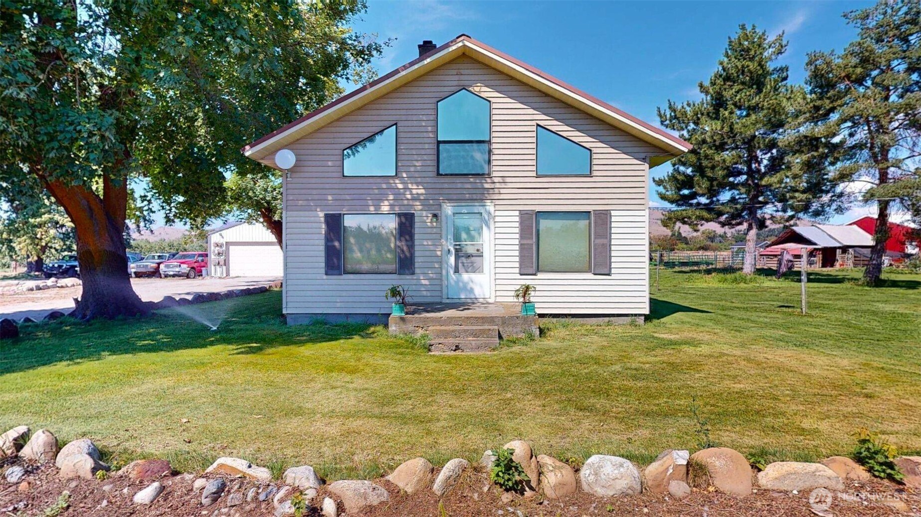 79 Duck Lake Road Omak, WA 98841 - Photo 3 of 40 a front view of house with yard and trees