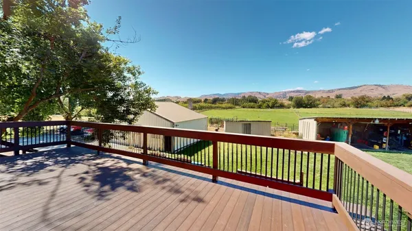an outdoor space with furniture and garden