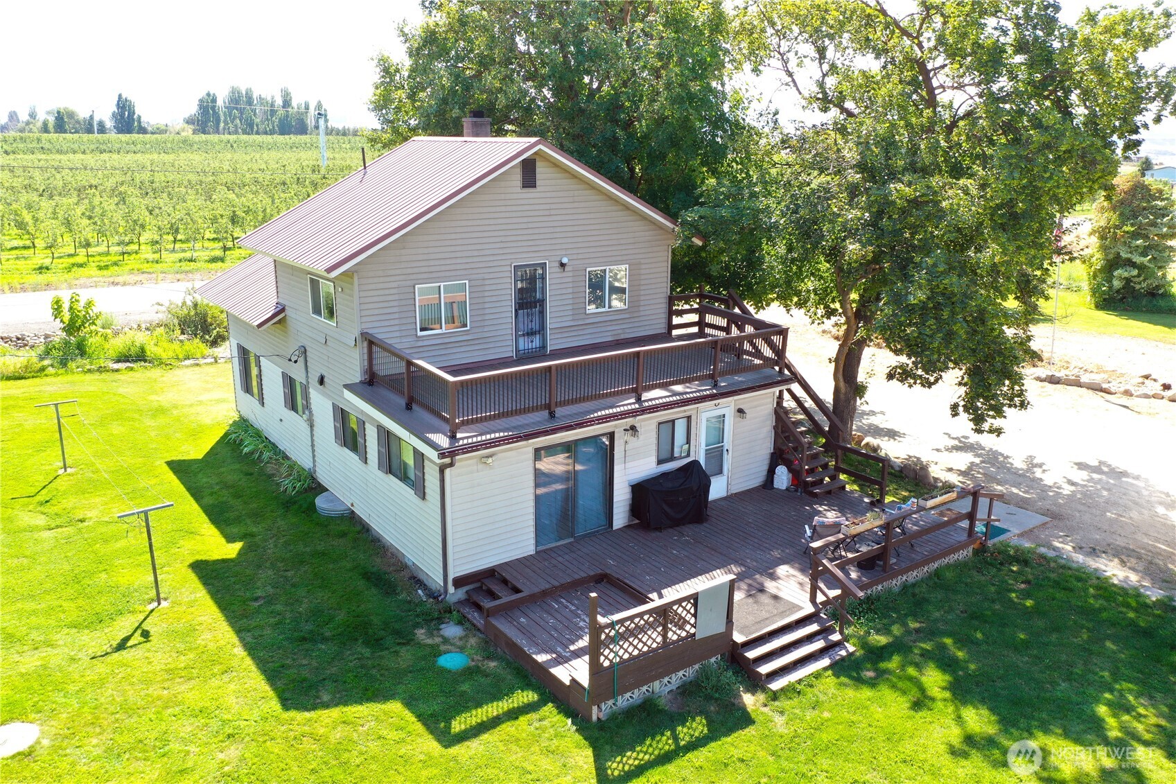 79 Duck Lake Road Omak, WA 98841 - Photo 4 of 40 a aerial view of a house with swimming pool and a yard
