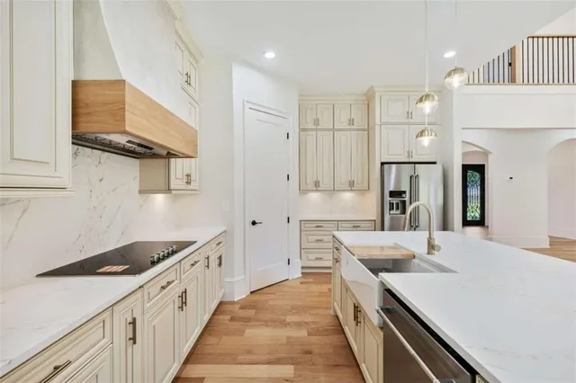 a view of a big room with wooden floor and windows