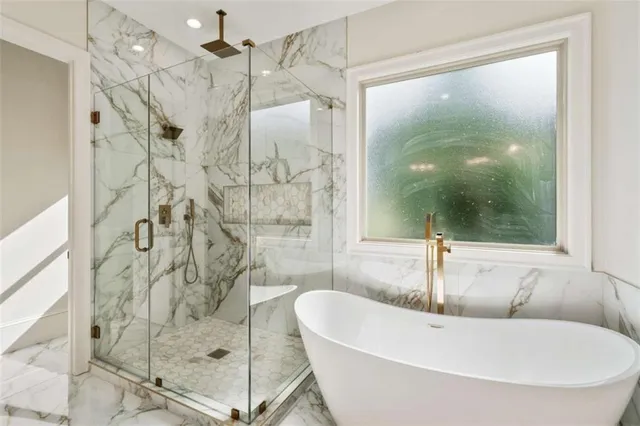 a bathroom with a glass shower door