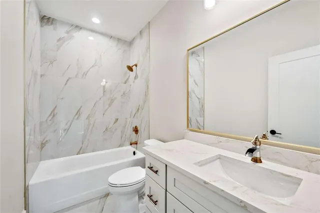 a spacious bedroom with a large window and a lawn chairs