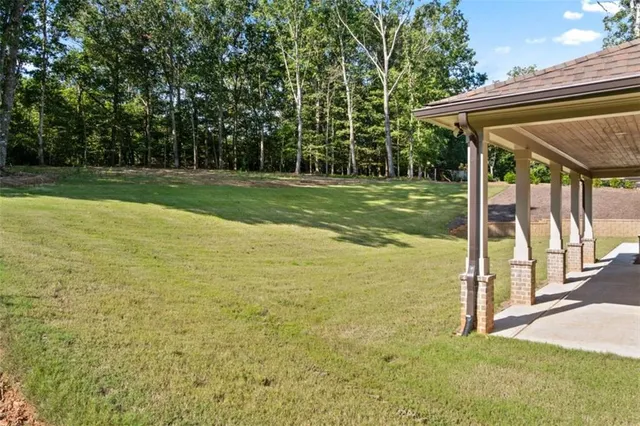 a swimming pool with some trees in the background