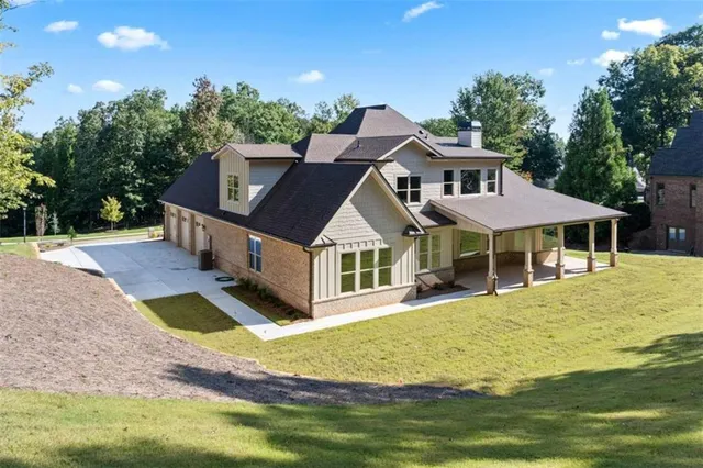 a front view of a house with garden
