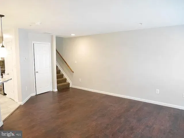 a view of an empty room with stairs