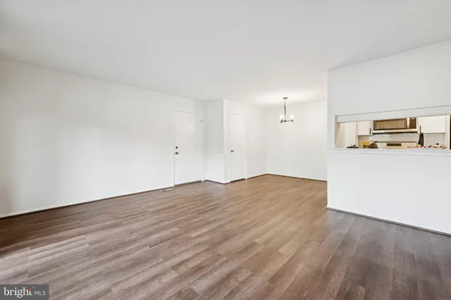 a view of a livingroom with wooden floor
