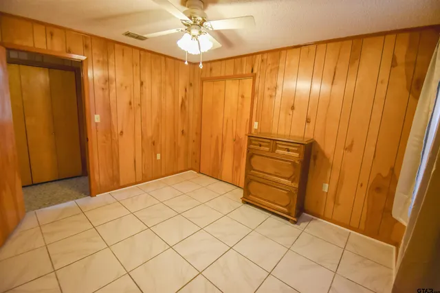a view of a room with wooden walls