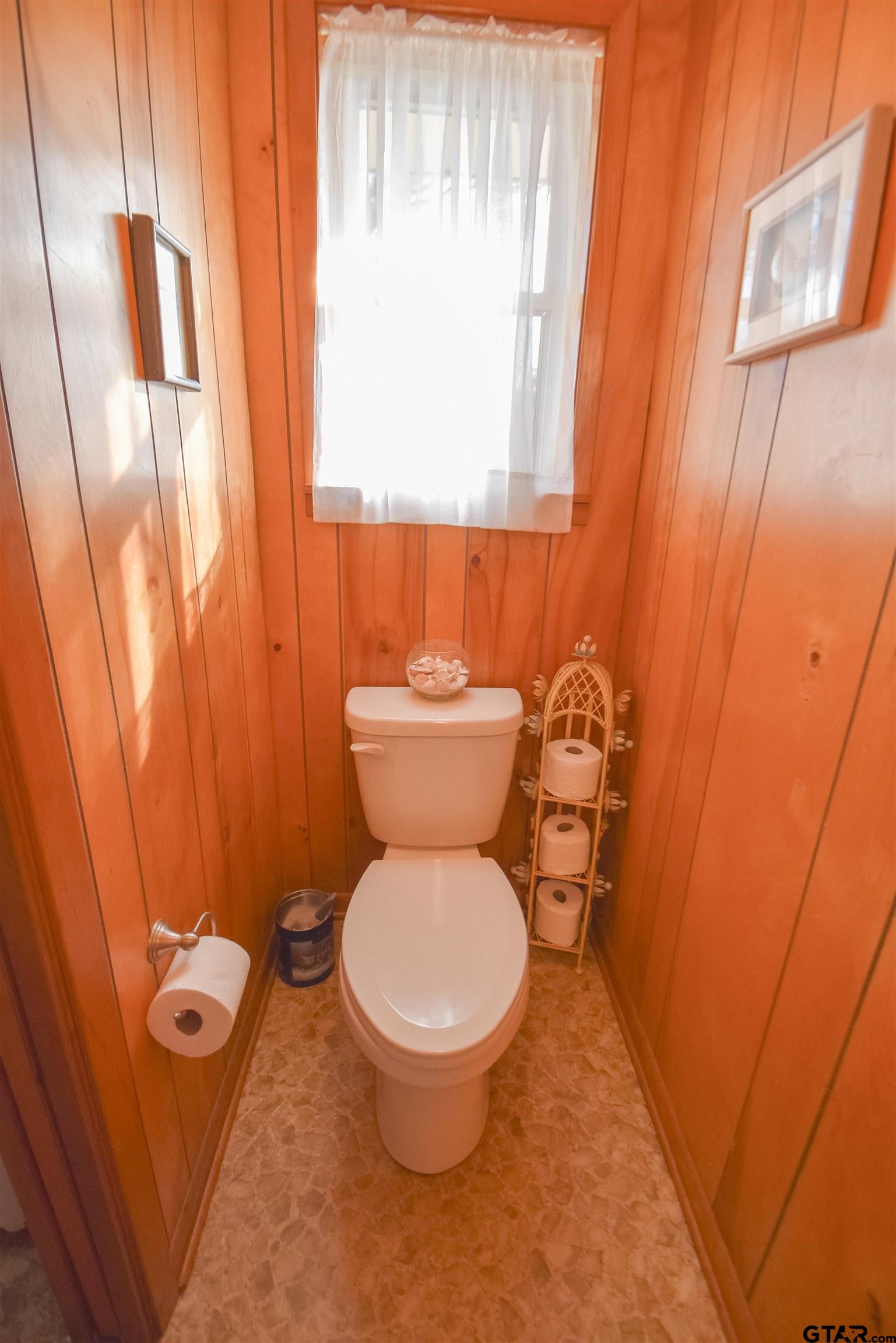 355 West Sugar Hill Road Reklaw, TX 75784 - Photo 31 of 38 a white toilet sitting next to a small window