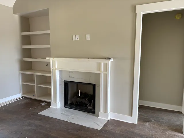 a living room with a fireplace