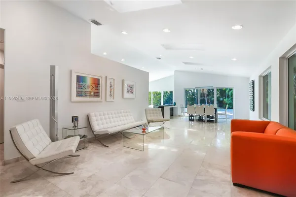 a living room with furniture and a large window