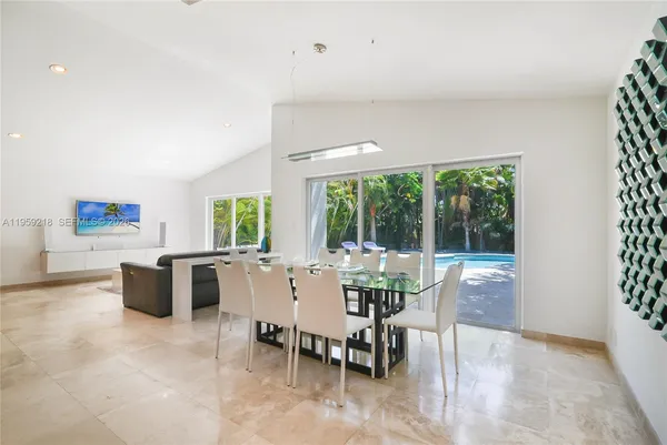 a view of a dining room with furniture window and outside view