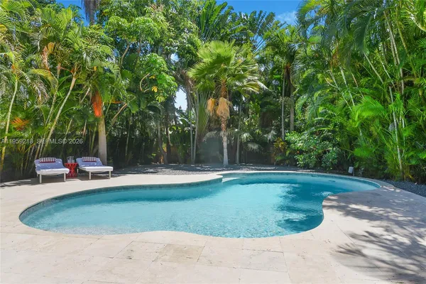 a view of a swimming pool with a sitting area