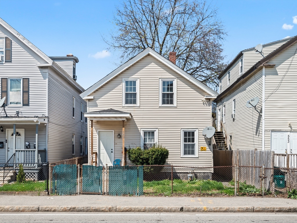 549 Cambridge Street Worcester, MA 01610 - Photo 1 of 22 a view of a white house with large windows and plants