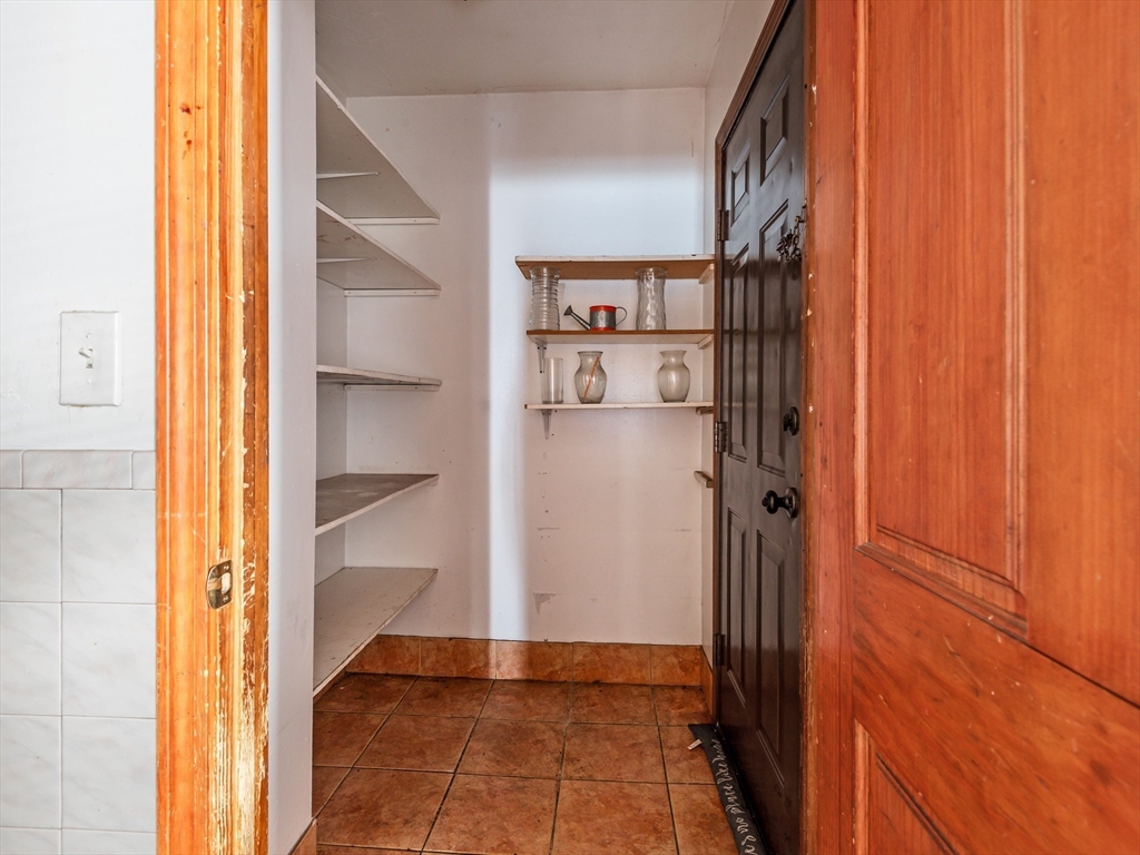 549 Cambridge Street Worcester, MA 01610 - Photo 15 of 22 a view of a hallway with wooden floor and entryway