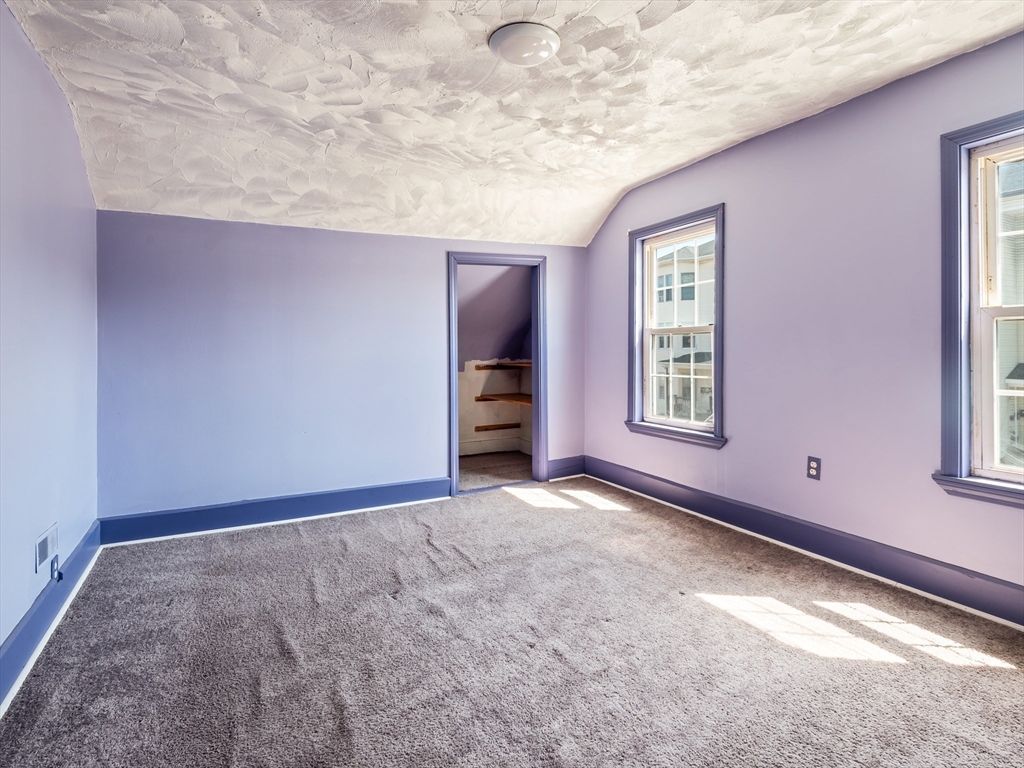 549 Cambridge Street Worcester, MA 01610 - Photo 16 of 22 an empty room with windows