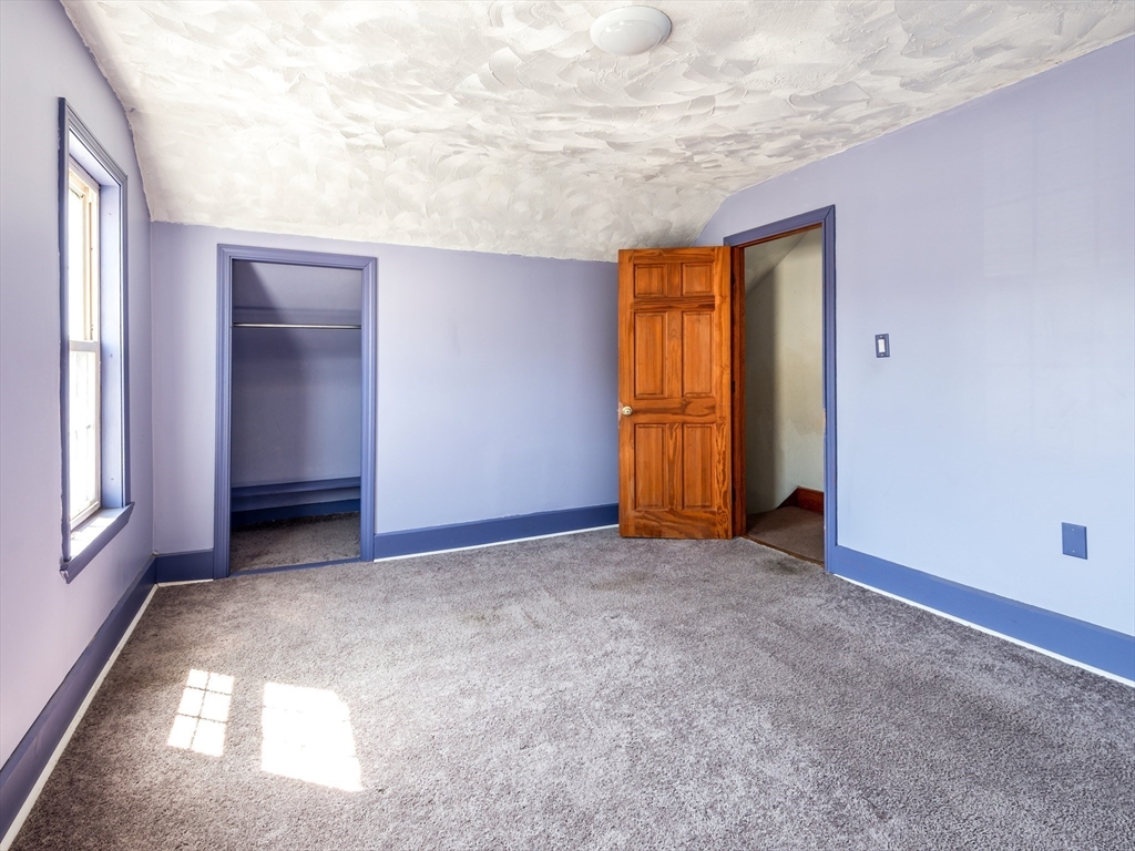549 Cambridge Street Worcester, MA 01610 - Photo 17 of 22 an empty room with windows